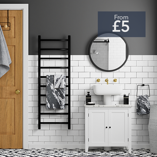 Monochrome bathroom with marble towels and black accessories